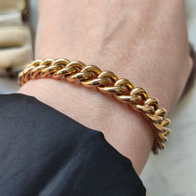 Load image into Gallery viewer, A rose gold curb link bracelet, modelled on a wrist
