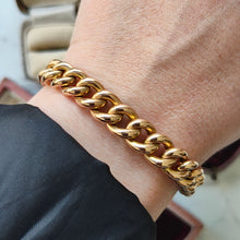 Load image into Gallery viewer, A rose gold curb link bracelet, modelled on a wrist
