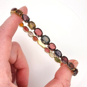 Vintage 9ct Gold Tourmaline, Garnet, Spinel, Iolite and Zircon Bracelet in hand