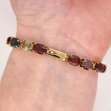 Load image into Gallery viewer, Vintage 9ct Gold Tourmaline, Garnet, Spinel, Iolite and Zircon Bracelet modelled
