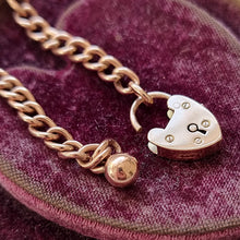 Load image into Gallery viewer, Edwardian 9ct Rose Gold Curb Link Bracelet with Heart Padlock &amp; Ball Charm open heart padlock
