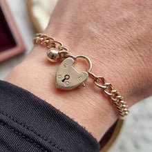 Load image into Gallery viewer, Edwardian 9ct Rose Gold Curb Link Bracelet with Heart Padlock &amp; Ball Charm modelled
