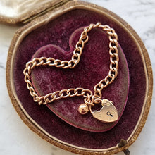 Load image into Gallery viewer, Edwardian 9ct Rose Gold Curb Link Bracelet with Heart Padlock &amp; Ball Charm in box
