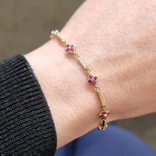 Load image into Gallery viewer, Vintage 9ct Gold Ruby and Diamond Cluster Bracelet modelled
