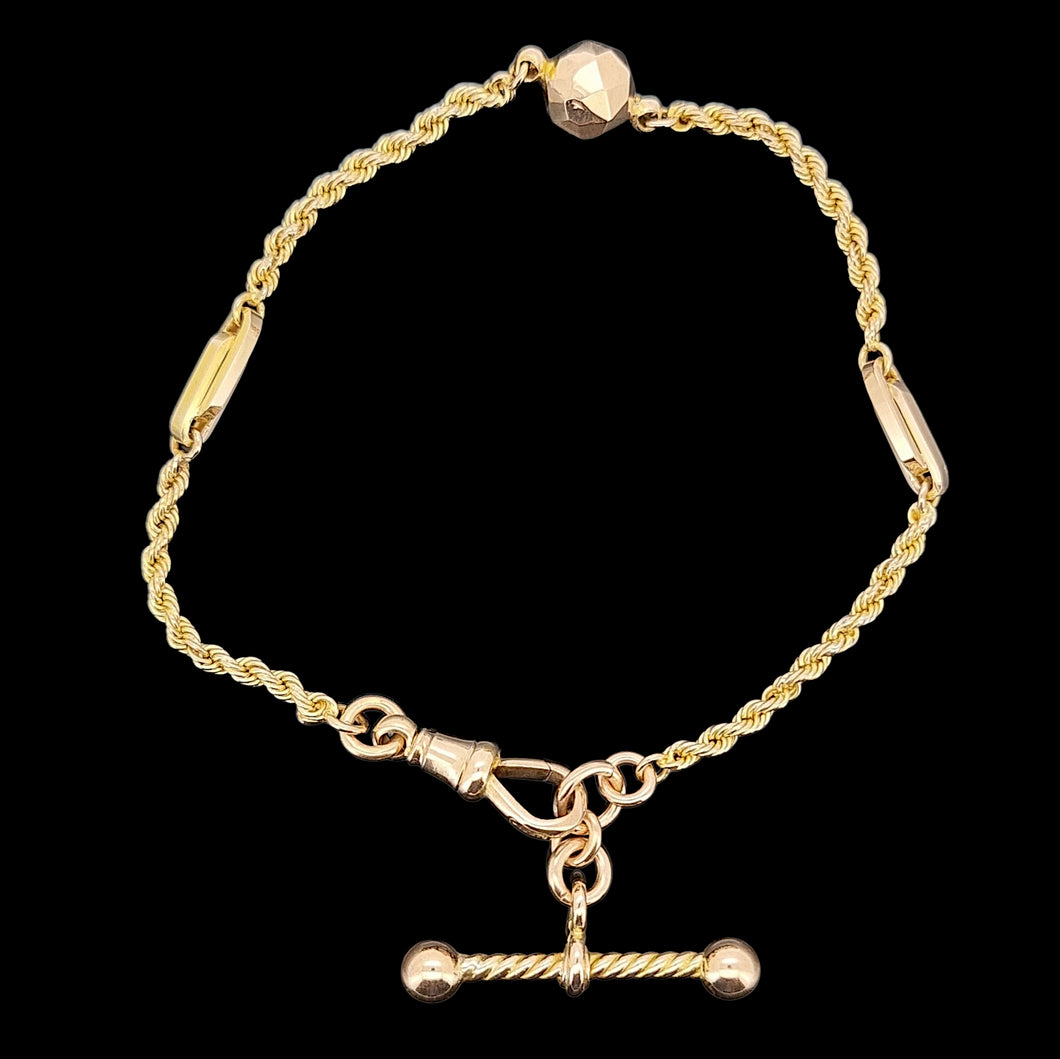 Antique 9ct Yellow Gold Fancy Rope Bracelet with T-Bar on a black background