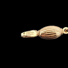 Load image into Gallery viewer, Gold bracelet clasp with an Italian stamp on a black background
