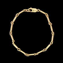Load image into Gallery viewer, A yellow gold tube link bracelet with lobster claw clasp, on a black background
