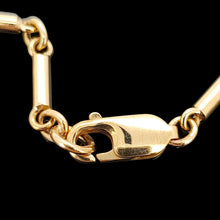 Load image into Gallery viewer, A yellow gold tube link bracelet with lobster claw clasp, on a black background
