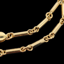 Load image into Gallery viewer, Close-up of the yellow gold tube links of a bracelet, on a black background
