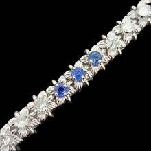Load image into Gallery viewer, A sapphire and diamond white gold line bracelet, on a black background
