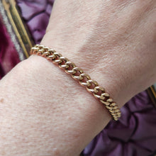 Load image into Gallery viewer, A rose gold curb link bracelet, modelled on a wrist
