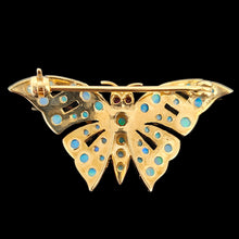 Load image into Gallery viewer, A yellow gold butterfly brooch with opals and ruby eyes, on a black background
