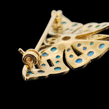 Load image into Gallery viewer, A yellow gold butterfly brooch with opals and ruby eyes, on a black background
