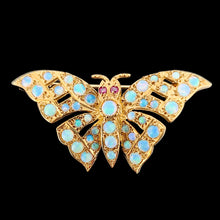 Load image into Gallery viewer, A yellow gold butterfly brooch with opals and ruby eyes, on a black background
