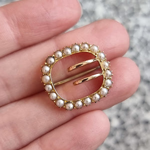 Antique 18ct Gold Pearl Buckle Brooch in hand