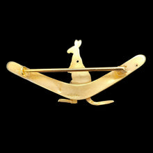Load image into Gallery viewer, A boomerang shaped brooch with a kangaroo, in yellow gold, on a black background
