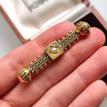 Load image into Gallery viewer, Victorian 15ct Gold Etruscan Style Pearl Bar Brooch in hand
