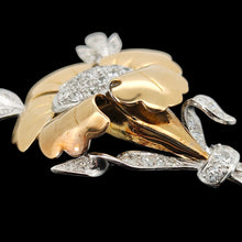 Load image into Gallery viewer, A two tone gold flower brooch with diamonds, on a black background
