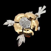Load image into Gallery viewer, A two tone gold flower brooch with diamonds, on a black background
