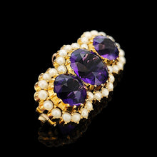 Load image into Gallery viewer, A yellow gold pearl and amethyst brooch, on a black background
