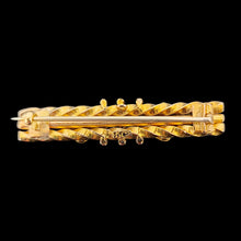 Load image into Gallery viewer, A yellow gold twist design bar brooch, on a black background
