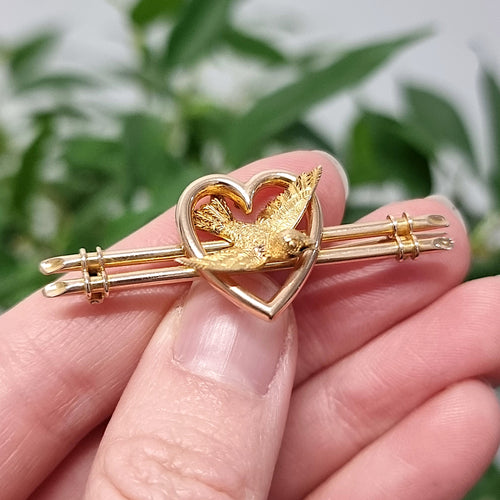 Antique 15ct Gold Swallow and Heart Bar Brooch in hand