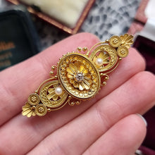 Load image into Gallery viewer, Victorian 15ct Gold Diamond and Pearl Locket Back Brooch in hand
