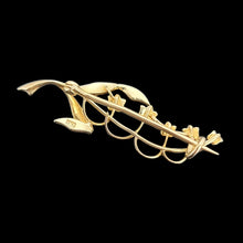 Load image into Gallery viewer, Gold brooch with leaf design on a black background
