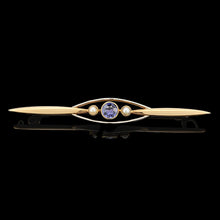 Load image into Gallery viewer, A yellow gold sapphire and pearl bar brooch, on a black background
