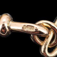 Load image into Gallery viewer, A gold trombone link chain necklace with a lobster claw clasp
