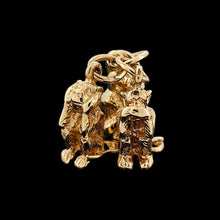Load image into Gallery viewer, Three wise monkeys charm in yellow gold, on a black background
