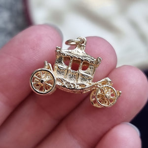Vintage 9ct Gold Coronation Carriage Charm in hand