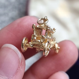 Vintage 9ct Gold Coronation Carriage Charm in hand