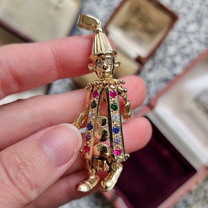 Vintage 9ct Gold Articulated Clown Pendant in hand