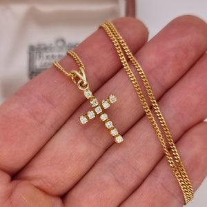 18ct Yellow Gold Brilliant Cut Diamond Cross Pendant in hand, with chain