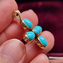 Load image into Gallery viewer, Vintage 9ct Gold Turquoise Cross Pendant in hand
