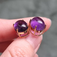 Load image into Gallery viewer, 9ct Gold Cabochon Amethyst Stud Earrings in hand
