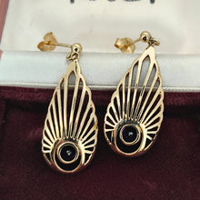 Load image into Gallery viewer, A pair of pear shaped fan design drop earrings with amethysts in yellow gold, in an antique jewellery box

