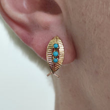 Load image into Gallery viewer, A yellow gold turquoise leaf shaped earring, modelled in an ear
