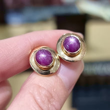 Load image into Gallery viewer, Vintage 14ct Gold Star Ruby Stud Earrings in hand
