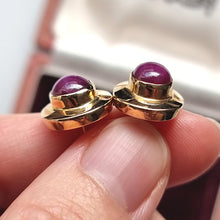 Load image into Gallery viewer, Vintage 14ct Gold Star Ruby Stud Earrings in hand
