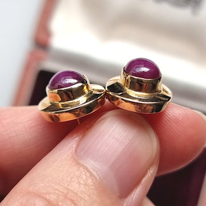 Vintage 14ct Gold Star Ruby Stud Earrings in hand