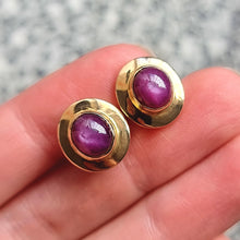Load image into Gallery viewer, Vintage 14ct Gold Star Ruby Stud Earrings in hand
