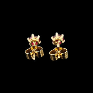 18ct Yellow Gold Ruby Solitaire Stud Earrings show from behind, on a black background