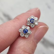 Load image into Gallery viewer, Vintage 18ct White Gold Sapphire and Diamond Cluster Stud Earrings in hand
