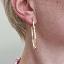 Load image into Gallery viewer, Vintage 18ct Yellow Gold Planished Hoop Earrings modelled
