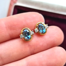 Load image into Gallery viewer, Vintage 18ct Gold Blue Topaz and Diamond Stud Earrings in hand
