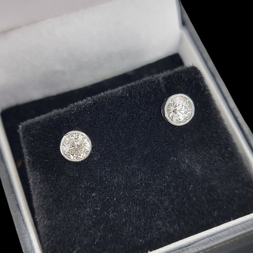 Diamond stud earrings in a jewellery box