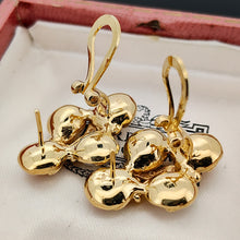 Load image into Gallery viewer, A pair of cluster earrings in yellow gold, with hinged clips and post fittings, in an antique box
