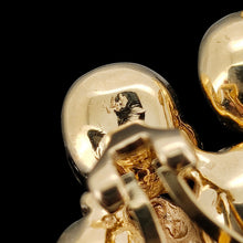 Load image into Gallery viewer, A 14K stamp on the back of a yellow gold earring
